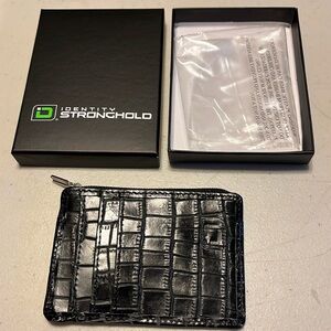 Identity stronghold Wallet. Brand new in its plastic and box.black crock print